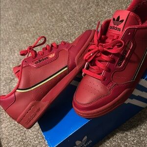 Adidas Red Sneakers with Black and Gold Details